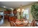 Cozy dining room with a wooden table set for four, bathed in natural light at 1409 Bloomingdale Ln, Mount Pleasant, SC 29466