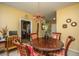 Elegant dining area with round table, decorative lighting, and views into the kitchen at 1409 Bloomingdale Ln, Mount Pleasant, SC 29466