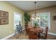 Bright dining area with windows, featuring a wood table and decor at 1409 Bloomingdale Ln, Mount Pleasant, SC 29466