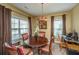 Cozy dining room with a round table, chandelier lighting, and large windows for natural light at 1409 Bloomingdale Ln, Mount Pleasant, SC 29466