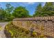 Community entrance with brick signage, colorful flowers, and landscaping at 1409 Bloomingdale Ln, Mount Pleasant, SC 29466
