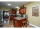 Cozy kitchen with bar seating, ample cabinet space, and views into the dining area at 1409 Bloomingdale Ln, Mount Pleasant, SC 29466