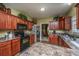 Spacious kitchen with dark wood cabinets, granite countertops, and stainless steel appliances at 1409 Bloomingdale Ln, Mount Pleasant, SC 29466