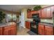 Well-equipped kitchen with dark wood cabinetry, modern appliances, and a breakfast nook at 1409 Bloomingdale Ln, Mount Pleasant, SC 29466