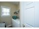 Laundry room with washer, shelving, window and white door at 1409 Bloomingdale Ln, Mount Pleasant, SC 29466