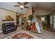 Inviting living room with vaulted ceilings, ceiling fan, and cozy seating arrangement at 1409 Bloomingdale Ln, Mount Pleasant, SC 29466
