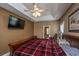 Bright main bedroom featuring tray ceiling, ceiling fan, and carpeted floor at 1409 Bloomingdale Ln, Mount Pleasant, SC 29466