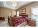 Main bedroom features a tray ceiling, windows, and classic furnishings at 1409 Bloomingdale Ln, Mount Pleasant, SC 29466