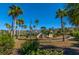 Community playground with multiple slides, climbing structures, and palm trees under a clear blue sky at 1409 Bloomingdale Ln, Mount Pleasant, SC 29466