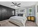 Comfortable bedroom showcasing a decorative accent wall, ceiling fan, and stylish furnishings at 141 Tall Pines Rd, Ladson, SC 29456