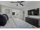 Bright bedroom with a black dresser and TV, and a glimpse of a connected bathroom at 141 Tall Pines Rd, Ladson, SC 29456