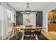 Charming dining room featuring a rustic wooden table and stylish sliding barn door at 141 Tall Pines Rd, Ladson, SC 29456