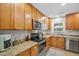 Cozy kitchen featuring granite counters, stainless appliances, and ample cabinet space at 141 Tall Pines Rd, Ladson, SC 29456