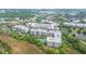 An aerial view showing the layout of a condo community near a lush green area at 145 Pier View St # 214, Daniel Island, SC 29492