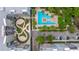 A community aerial view displays a stunning pool, meticulously landscaped green space, and well-kept apartment building exteriors at 145 Pier View St # 214, Daniel Island, SC 29492