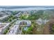 Scenic aerial view showcases the coastal community near the waterway, featuring homes, a pool, and lush landscaping at 145 Pier View St # 214, Daniel Island, SC 29492