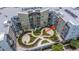 An elevated view showing the complex's garden courtyard with lush landscaping and apartment balconies at 145 Pier View St # 214, Daniel Island, SC 29492