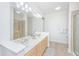 Large bathroom with double sinks, shower and neutral color palette at 145 Pier View St # 214, Daniel Island, SC 29492
