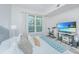 Bright bedroom with a view, exercise bike and comfortable pillows at 145 Pier View St # 214, Daniel Island, SC 29492