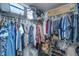 Organized walk-in closet with shelving and hanging storage for clothing at 145 Pier View St # 214, Daniel Island, SC 29492