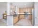 Stylish kitchen featuring stainless steel appliances, granite countertops, and wood cabinets with open floor plan at 145 Pier View St # 214, Daniel Island, SC 29492
