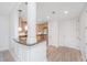 Bright entryway leading to a kitchen with wooden cabinetry, granite countertops, and stainless steel appliances at 145 Pier View St # 214, Daniel Island, SC 29492
