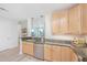 Beautiful kitchen with stainless steel appliances, granite countertops, and wood cabinets in a modern home at 145 Pier View St # 214, Daniel Island, SC 29492