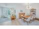 Inviting living area with neutral decor, wood floors, a dining table, and plenty of natural light at 145 Pier View St # 214, Daniel Island, SC 29492