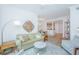 Bright living room with a modern sofa, stylish chairs, an attractive rug and an open-concept layout at 145 Pier View St # 214, Daniel Island, SC 29492