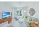 Bright living room with modern furniture, stylish décor, and a large window with natural light at 145 Pier View St # 214, Daniel Island, SC 29492
