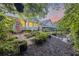 Secluded backyard oasis with lush greenery, manicured shrubs, and an inviting patio setup at 148 Longdale Dr, Summerville, SC 29483