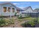 Charming backyard features lush landscaping, a cozy seating area, and a serene ambiance at 148 Longdale Dr, Summerville, SC 29483