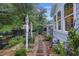 Beautiful backyard features a garden, walking path, and exterior house views at 148 Longdale Dr, Summerville, SC 29483