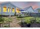 Charming backyard landscape with wrought iron fencing, manicured greenery, and outdoor seating at 148 Longdale Dr, Summerville, SC 29483