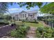 Idyllic backyard with a beautifully landscaped garden and a charming outdoor seating area at 148 Longdale Dr, Summerville, SC 29483