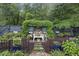 Enchanting backyard garden features a beautiful bench with climbing plants, offering a tranquil retreat at 148 Longdale Dr, Summerville, SC 29483