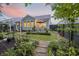 Lush backyard garden with an inviting patio setup perfect for outdoor relaxation and entertaining at 148 Longdale Dr, Summerville, SC 29483