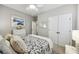 A serene bedroom features double closets and a cozy bed with decorative pillows and patterned bedspread at 148 Longdale Dr, Summerville, SC 29483