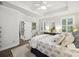 Comfortable bedroom featuring natural light, ceiling fan, and plush bedding at 148 Longdale Dr, Summerville, SC 29483