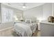 Cozy bedroom with neutral tones, ceiling fan, and a sunny window for a relaxing ambiance at 148 Longdale Dr, Summerville, SC 29483