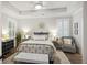 Elegant bedroom features a large bed, ceiling fan, and stylish decor accents at 148 Longdale Dr, Summerville, SC 29483