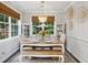 Light-filled dining room features a chandelier, wainscotting, and a wooden table at 148 Longdale Dr, Summerville, SC 29483