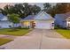 Charming home exterior with a well-maintained yard, driveway, and inviting entrance at 148 Longdale Dr, Summerville, SC 29483
