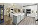 Open-concept kitchen and living area featuring a large island, stainless steel appliances, and hardwood floors at 148 Longdale Dr, Summerville, SC 29483