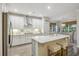Bright, spacious kitchen with white cabinets, a large center island, and modern stainless-steel appliances at 148 Longdale Dr, Summerville, SC 29483