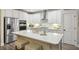 The bright kitchen with a center island, stainless appliances and ample counter space is an entertainer's dream at 148 Longdale Dr, Summerville, SC 29483