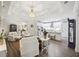 Bright living room boasts hardwood floors, coffered ceiling, and an open view to the modern white kitchen at 148 Longdale Dr, Summerville, SC 29483