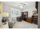 Functional home office with a built-in desk, comfortable chair, and natural lighting at 148 Longdale Dr, Summerville, SC 29483