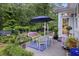 Back patio with furniture, plantings, and decor with view to backyard at 148 Longdale Dr, Summerville, SC 29483