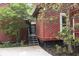 This shot of the back entrance shows well-manicured landscaping, an entrance staircase, and unique architectural details at 152 Mansfield Blvd, Charleston, SC 29418